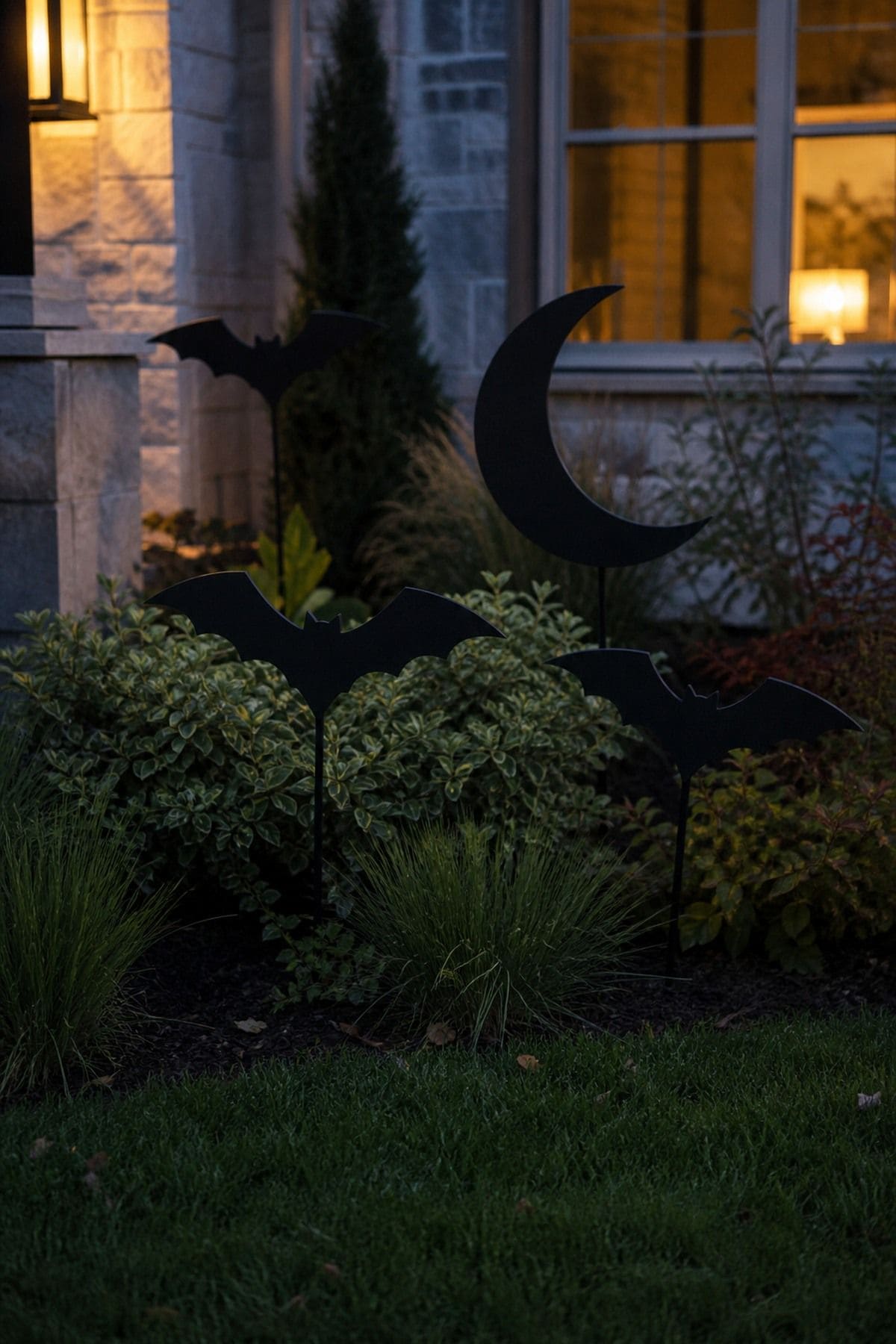 Yard Silhouette Moment shown as a realistic Pretty Wild World image for 18 Outdoor Halloween Decor Ideas for a Spooky Weather-Ready Yard.