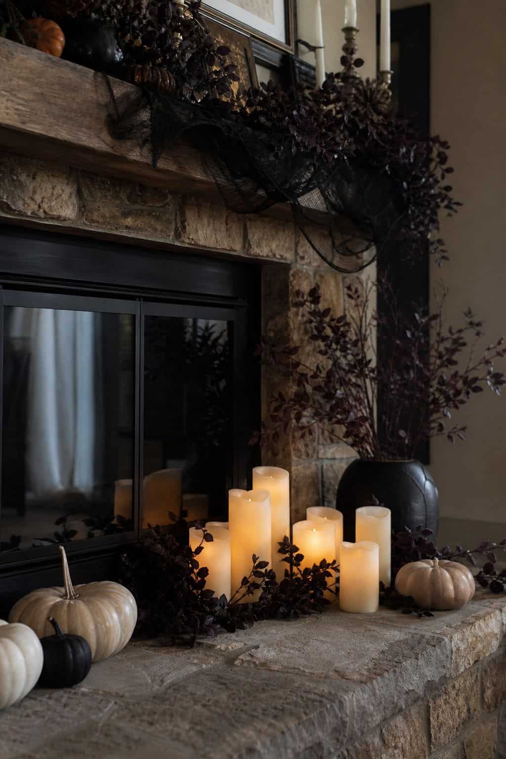 Battery Pillars on the Hearth shown as a realistic Pretty Wild World image for 17 Halloween Mantle Decor Ideas for a Moody Fireplace.