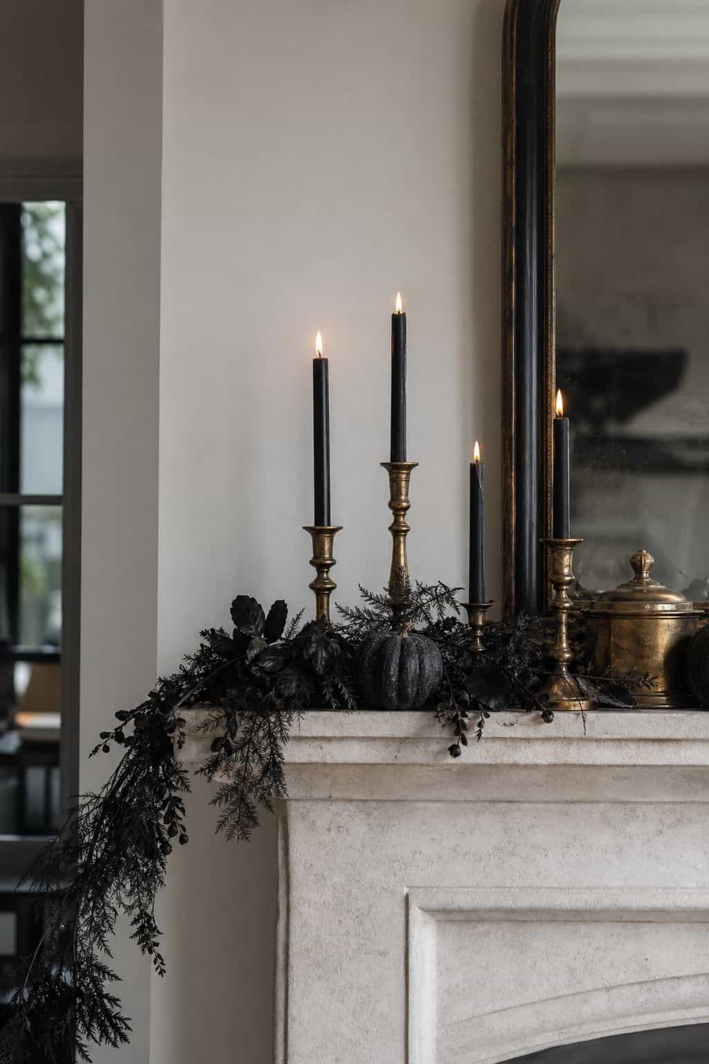 Brass Candle Contrast shown as a realistic Pretty Wild World image for 17 Halloween Mantle Decor Ideas for a Moody Fireplace.