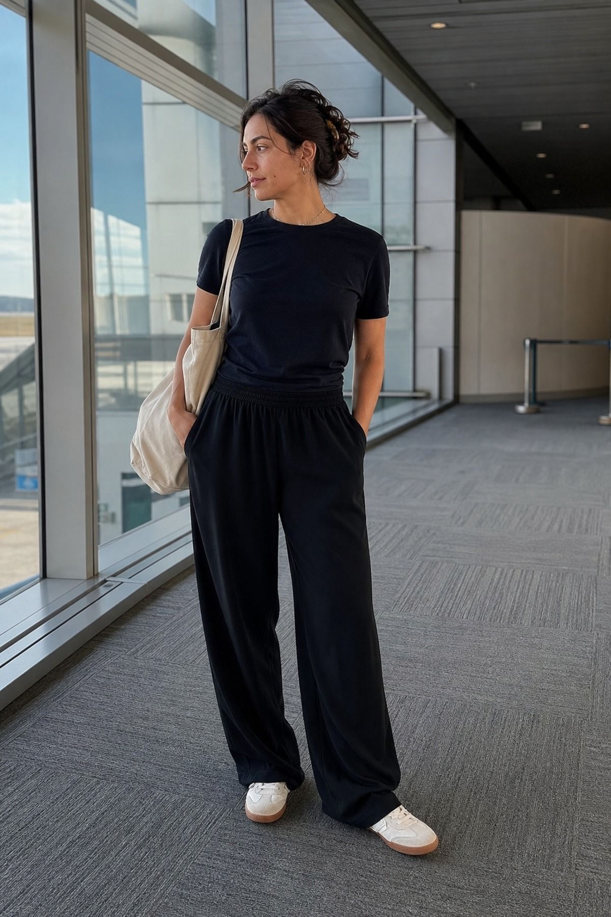 Black Trousers with a Soft Tee shown as a realistic Pretty Wild World image for 17 Long Haul Flight Outfit Ideas That Are Comfortable Without Looking Sloppy.