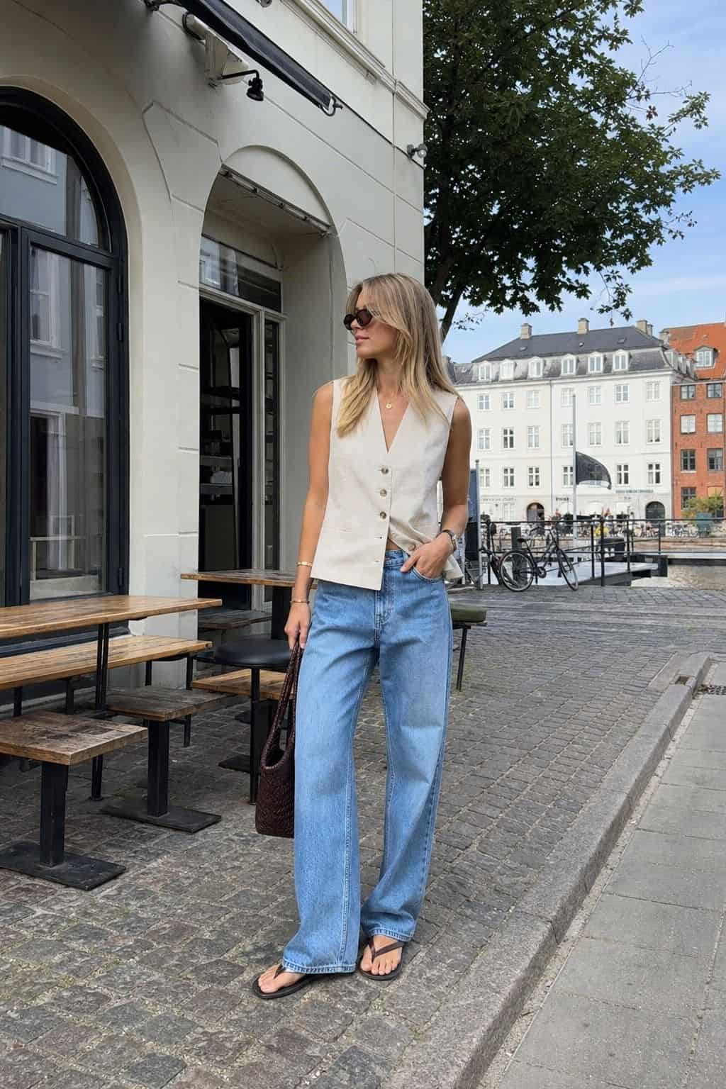 Relaxed Denim with a Sleeveless Vest styled as a Copenhagen summer outfit idea from Pretty Wild World.