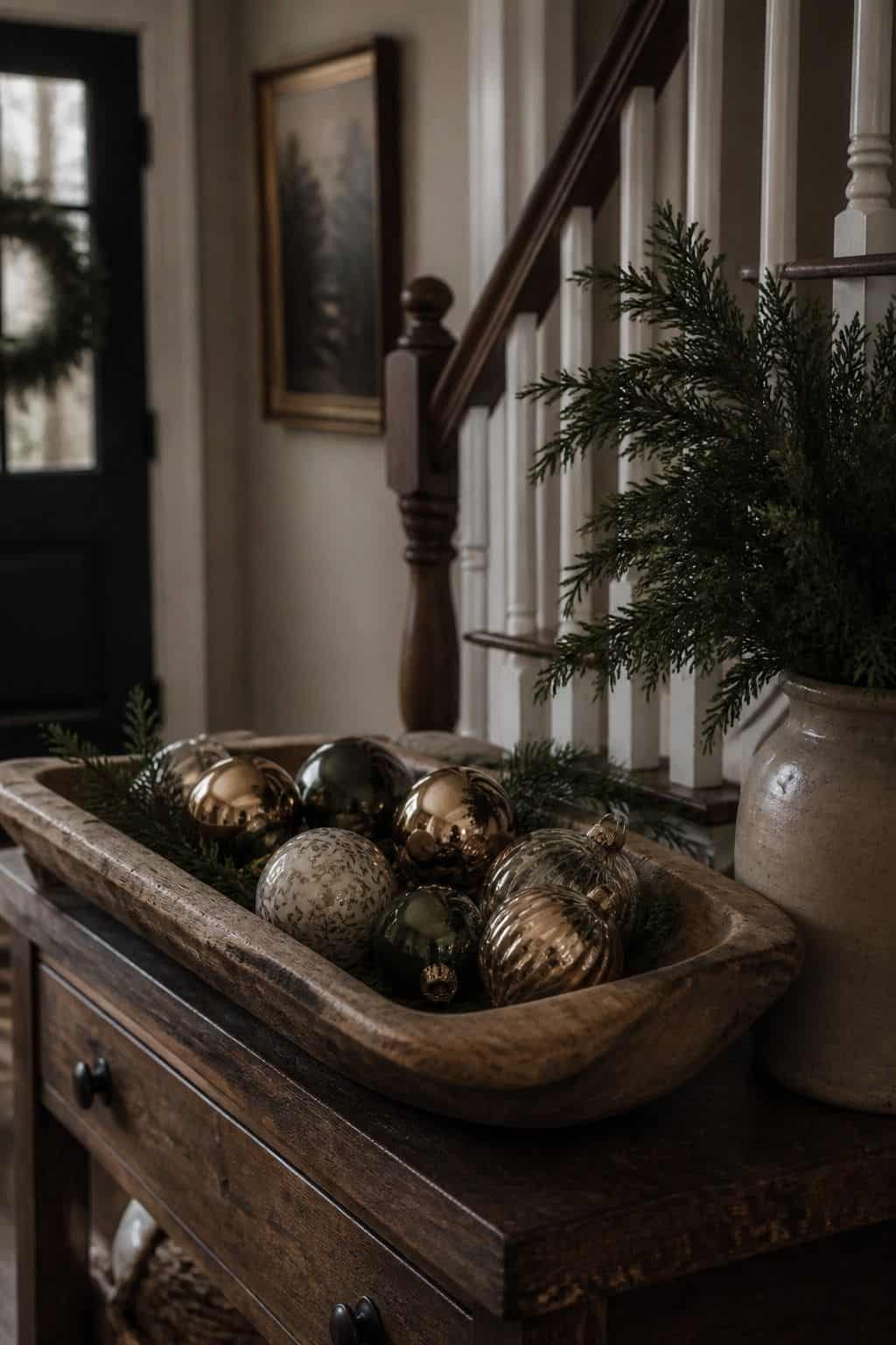 Cozy Christmas decor idea with entry bowl of ornaments in a warm holiday home.