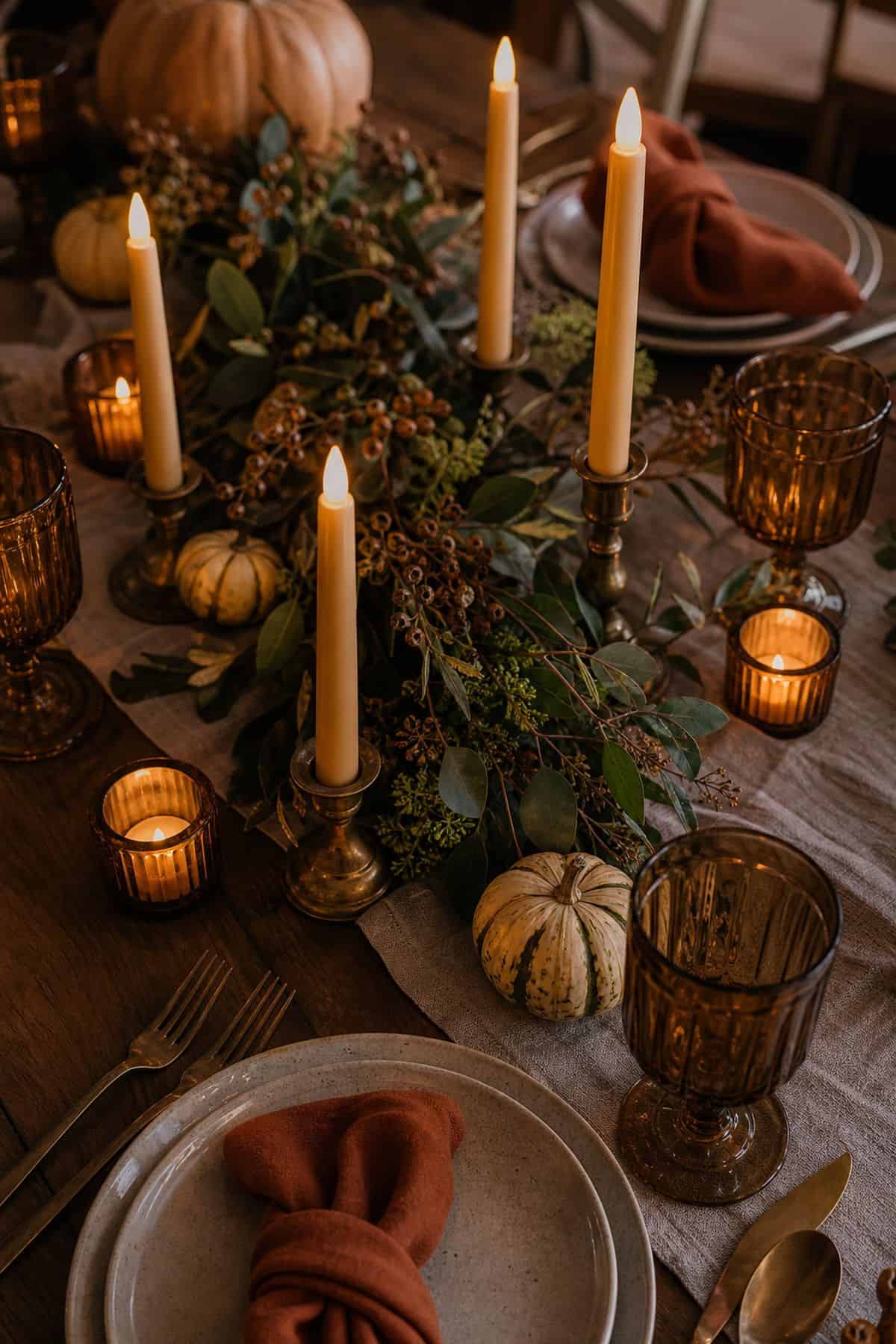 Battery candle glow layered across a Friendsgiving table