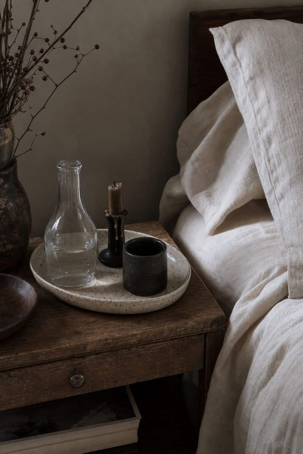 Winter bedroom decor idea with ceramic bedside tray in a calm cozy bedroom.