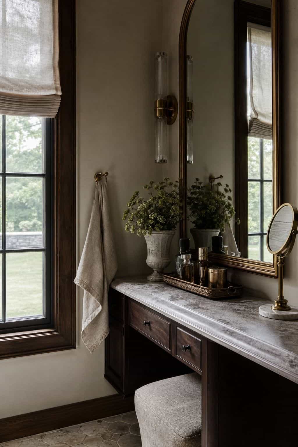 Small towel hook within reach of a bathroom vanity makeup counter