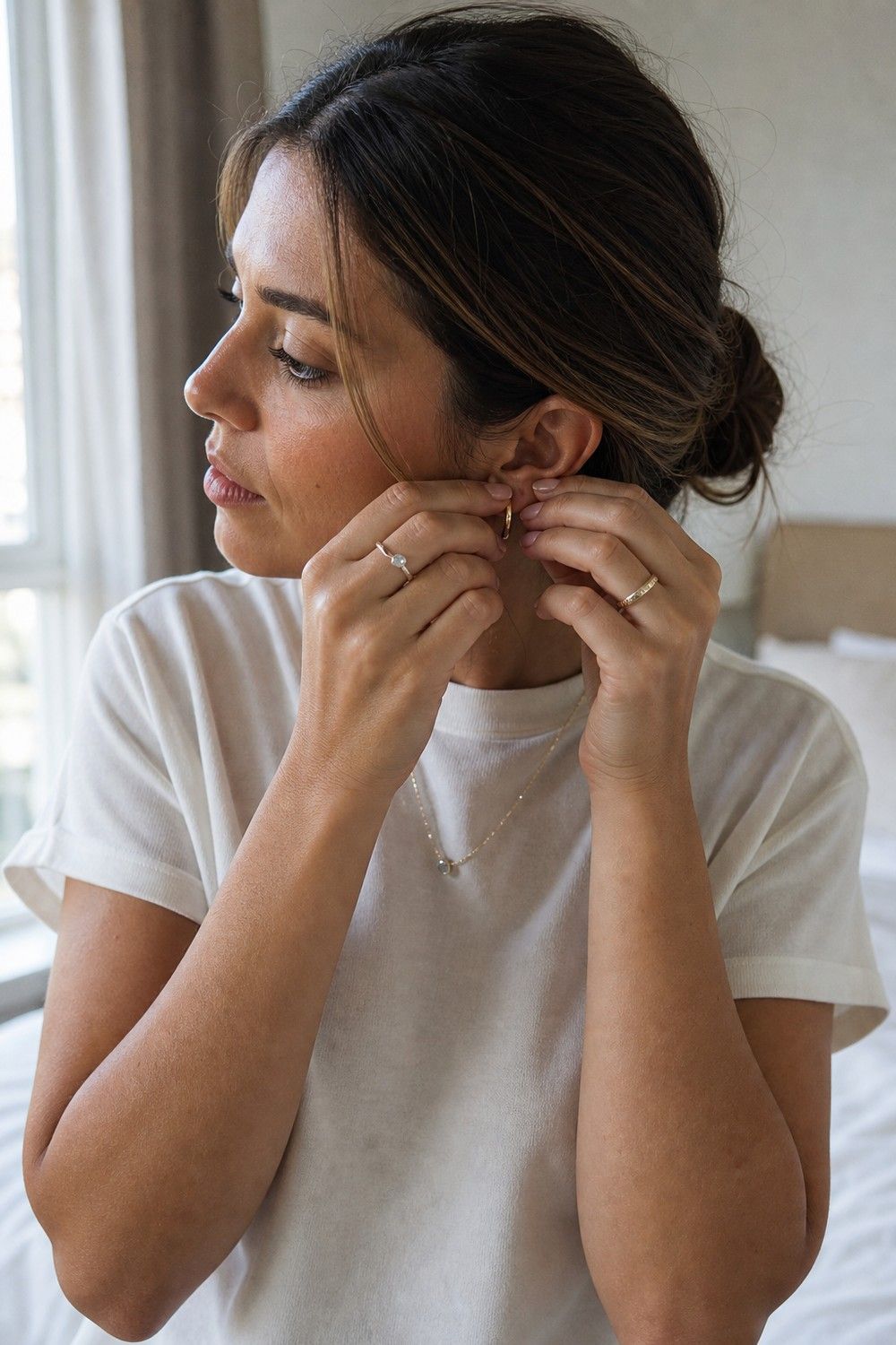 Simple Jewelry shown as a realistic Pretty Wild World image for 21 Basic Clothes Essentials That Make Getting Dressed Easier.