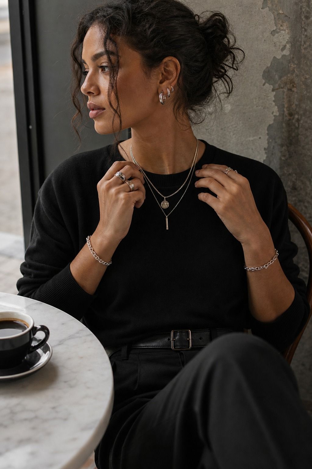 Silver Jewelry with Monochrome Basics shown as a realistic Pretty Wild World image for 17 Clean Goth Outfit Ideas That Master the Minimalist Dark Aesthetic.