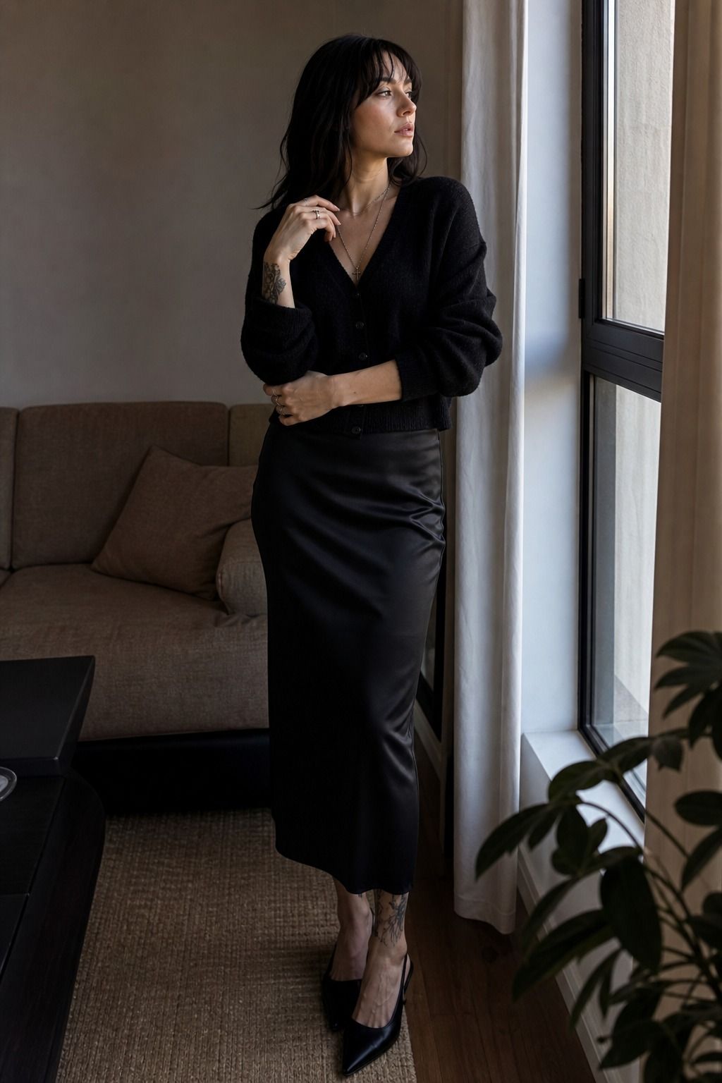 Soft Cardigan with a Satin Skirt shown as a realistic Pretty Wild World image for 17 Clean Goth Outfit Ideas That Master the Minimalist Dark Aesthetic.