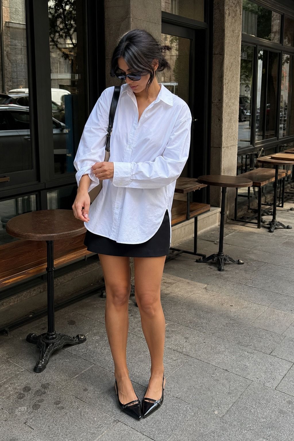 Oversized Shirt with a Mini Skirt shown as a realistic Pretty Wild World image for 17 Downtown Outfit Ideas That Nail the City-Cool Aesthetic.