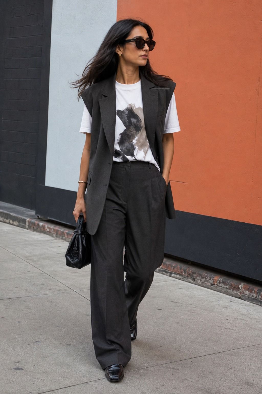 Graphic Tee with a Tailored Layer shown as a realistic Pretty Wild World image for 17 Downtown Outfit Ideas That Nail the City-Cool Aesthetic.