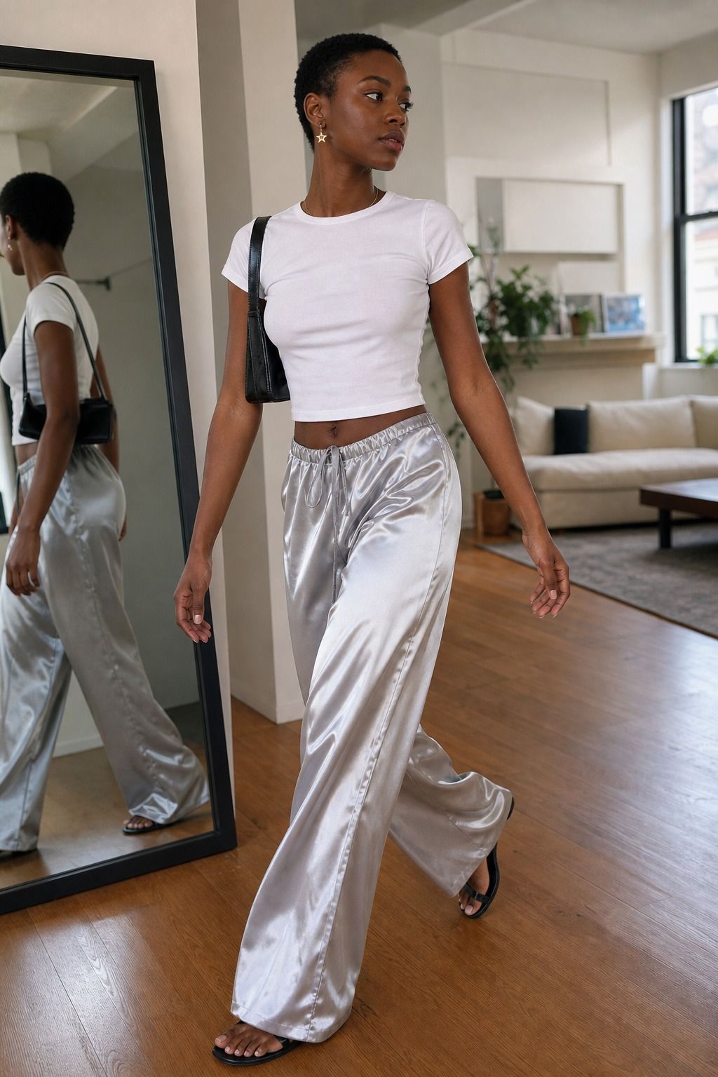 Satin Pants with a Baby Tee shown as a realistic Pretty Wild World image for 17 Stargirl Outfit Ideas That Bring the Y2K Celestial Aesthetic to Life.