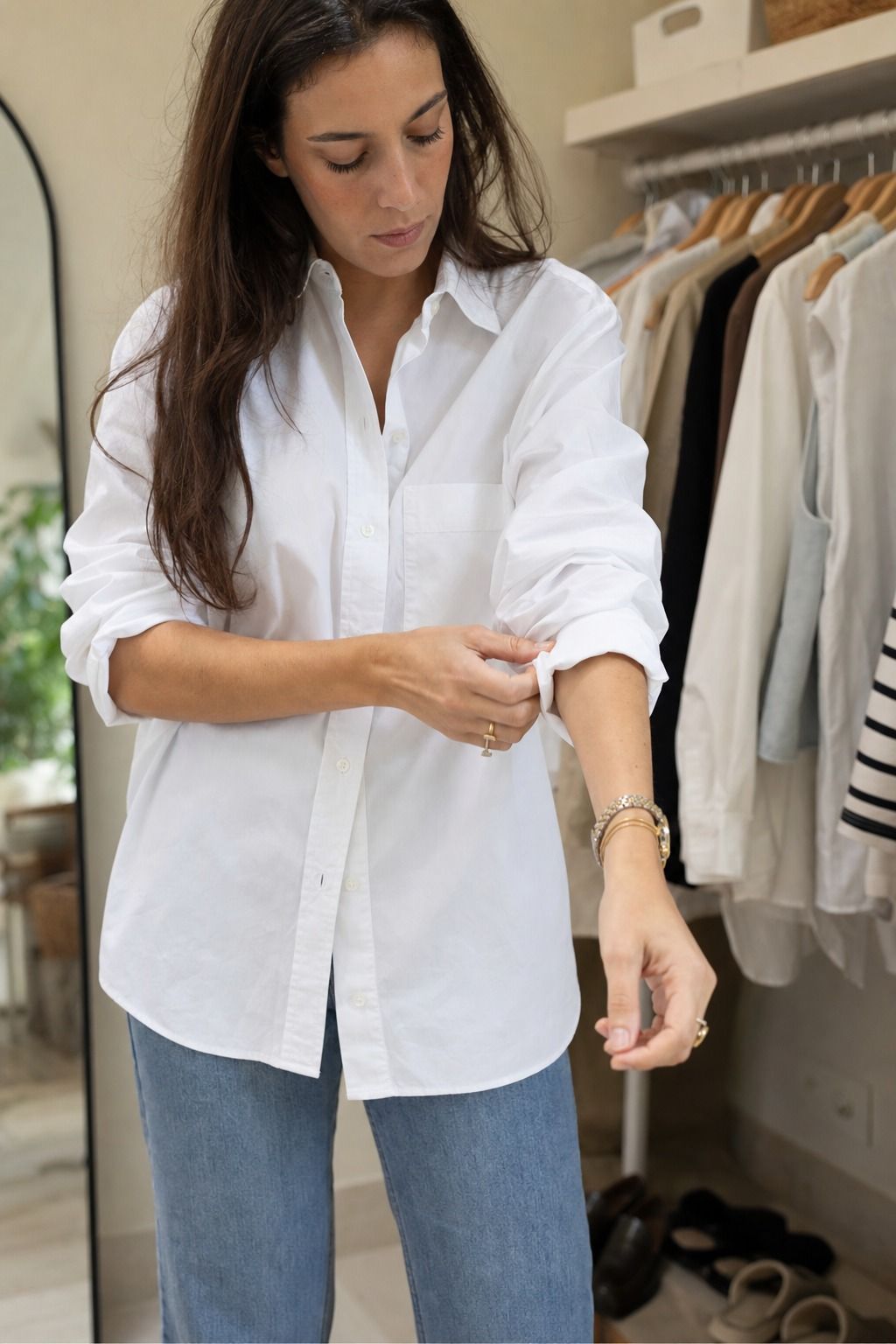 Straight Jeans with a Button Down shown as a realistic Pretty Wild World image for 20 Travel Capsule Wardrobe Ideas That Fit Real Itineraries.
