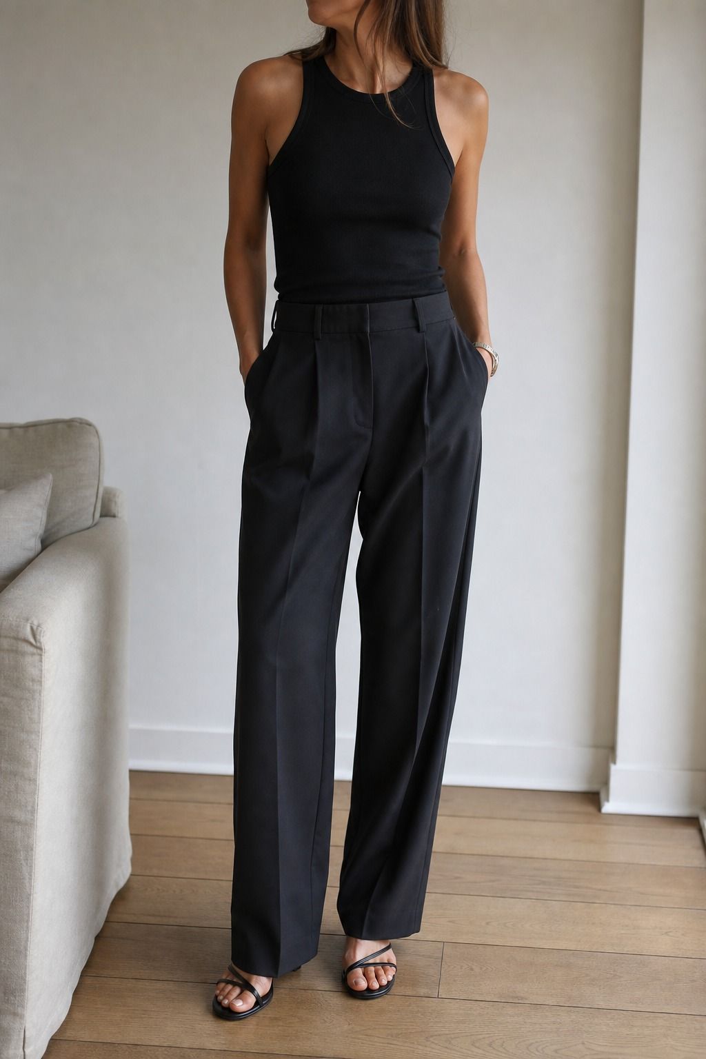 Black Tank with Tailored Trousers shown as a realistic Pretty Wild World image for 19 Basic Minimalist Outfit Ideas That Make Getting Dressed Easier.