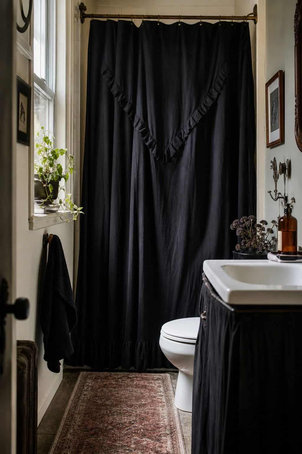 Whimsigoth bathroom with a dark shower curtain and warm vintage accents