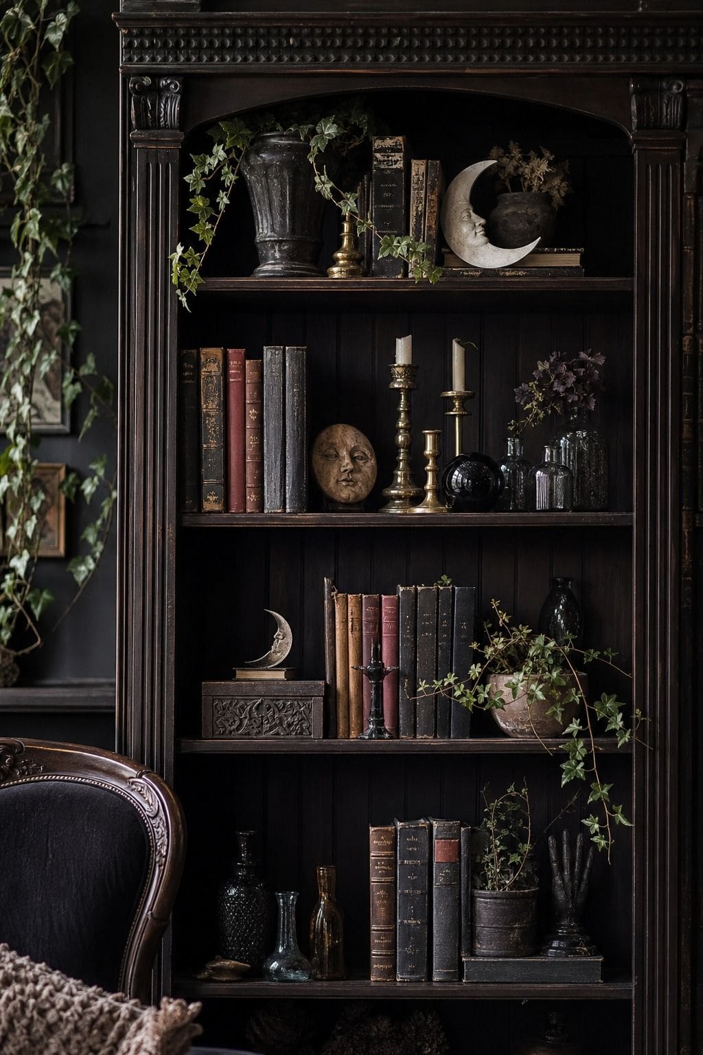 Dark wood bookshelf filled with books and antique whimsigoth accents.