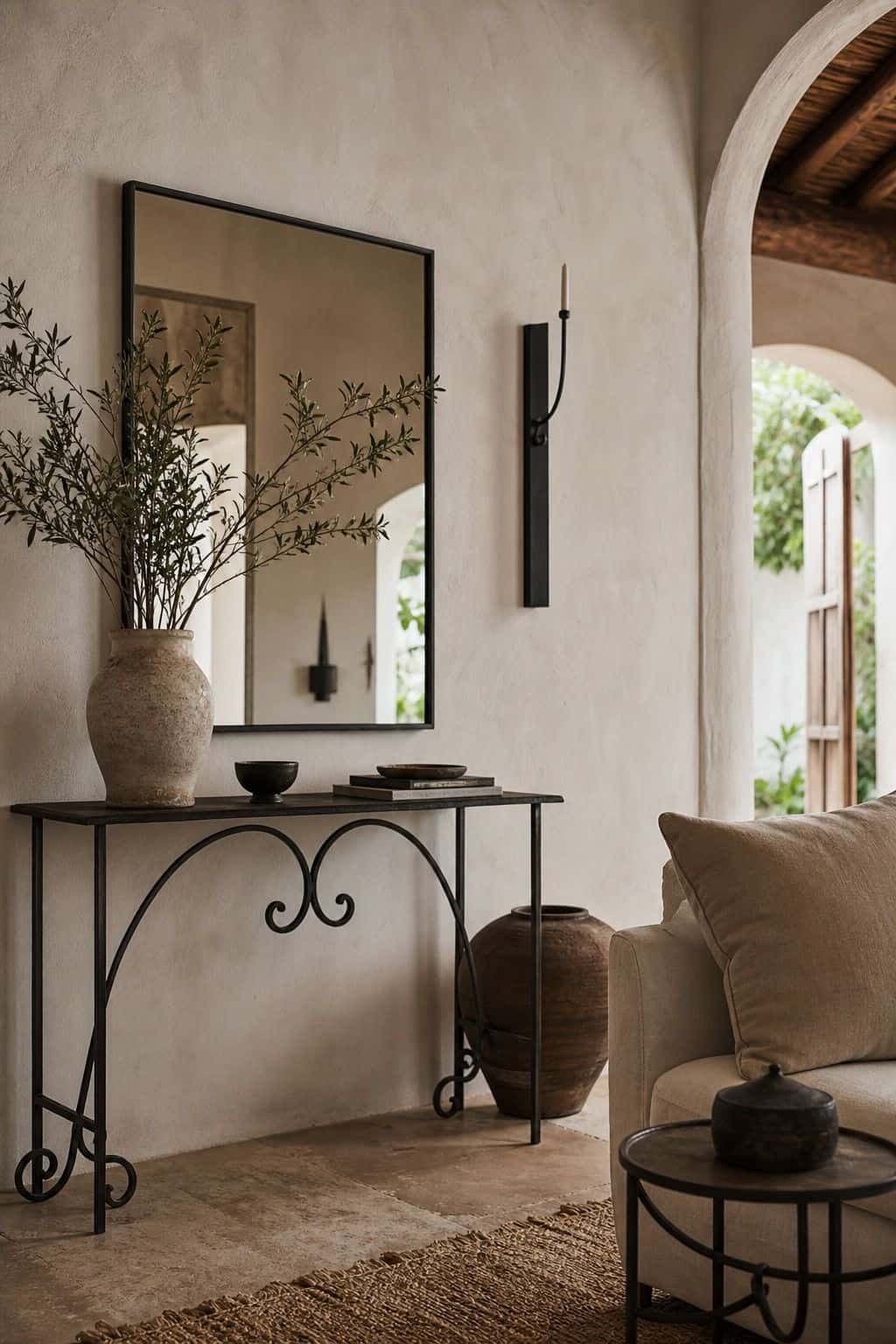 Mediterranean furniture inspiration for wrought-iron accents, styled in a warm sun-washed home with natural textures, aged wood, linen, terracotta, woven details, and soft daylight. This realistic editorial image supports section 3 of the guide with an inviting lived-in look, showing how the piece can bring relaxed coastal European character, handcrafted warmth, and timeless rustic elegance into a modern room.