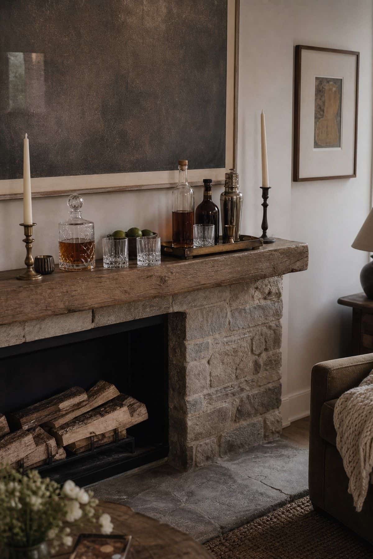 Arrange Cocktail Items on the Mantel for a Casual Bar Look shown as a realistic Pretty Wild World image for 15 Bar Ideas for Home Living Rooms for a More Curated Home Aesthetic.