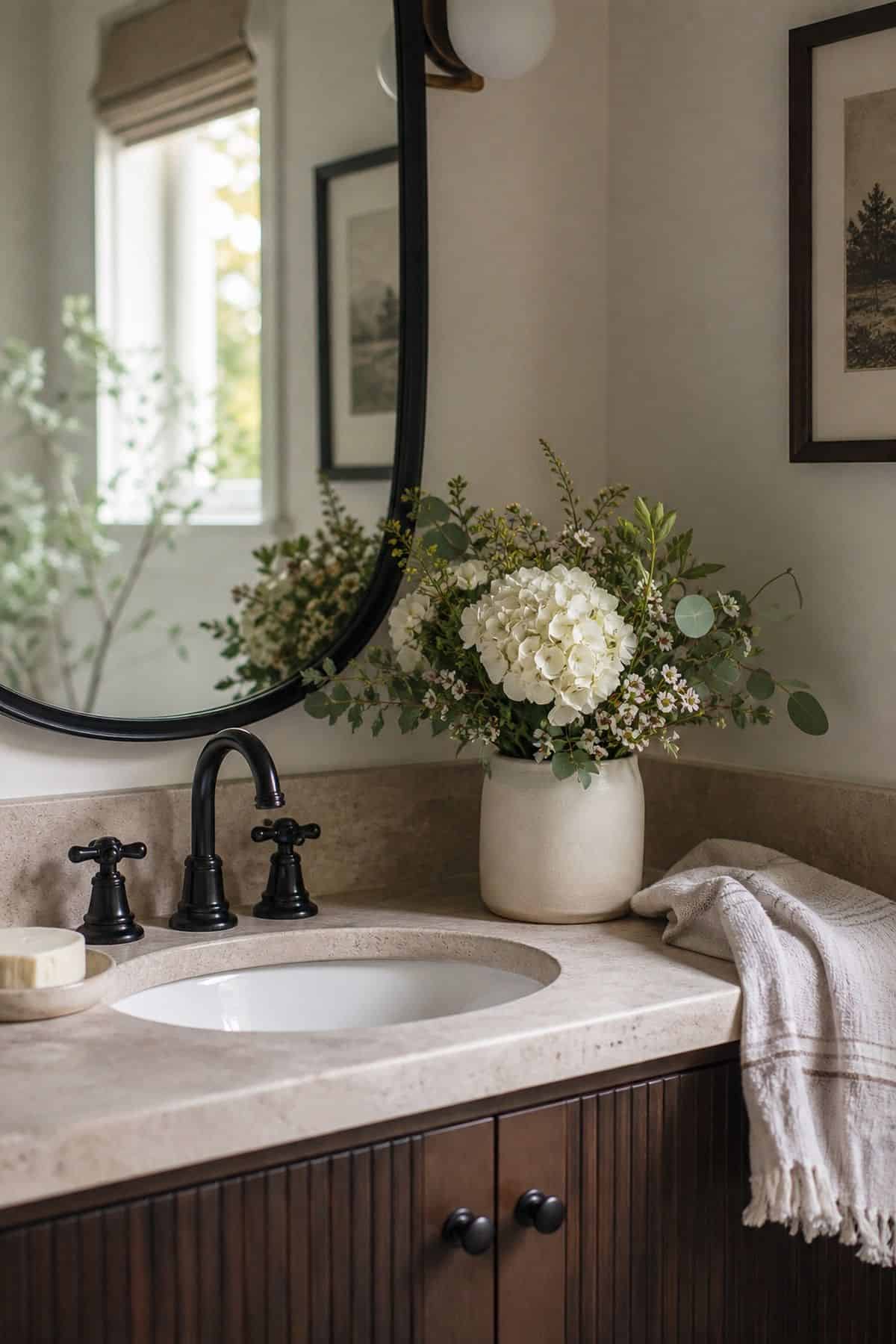 Place a Fresh Bouquet or Small Potted Plant on the Counter shown as a realistic Pretty Wild World image for 15 Half Bathroom Decor Ideas for a Fresh, Spa-Like Bathroom.