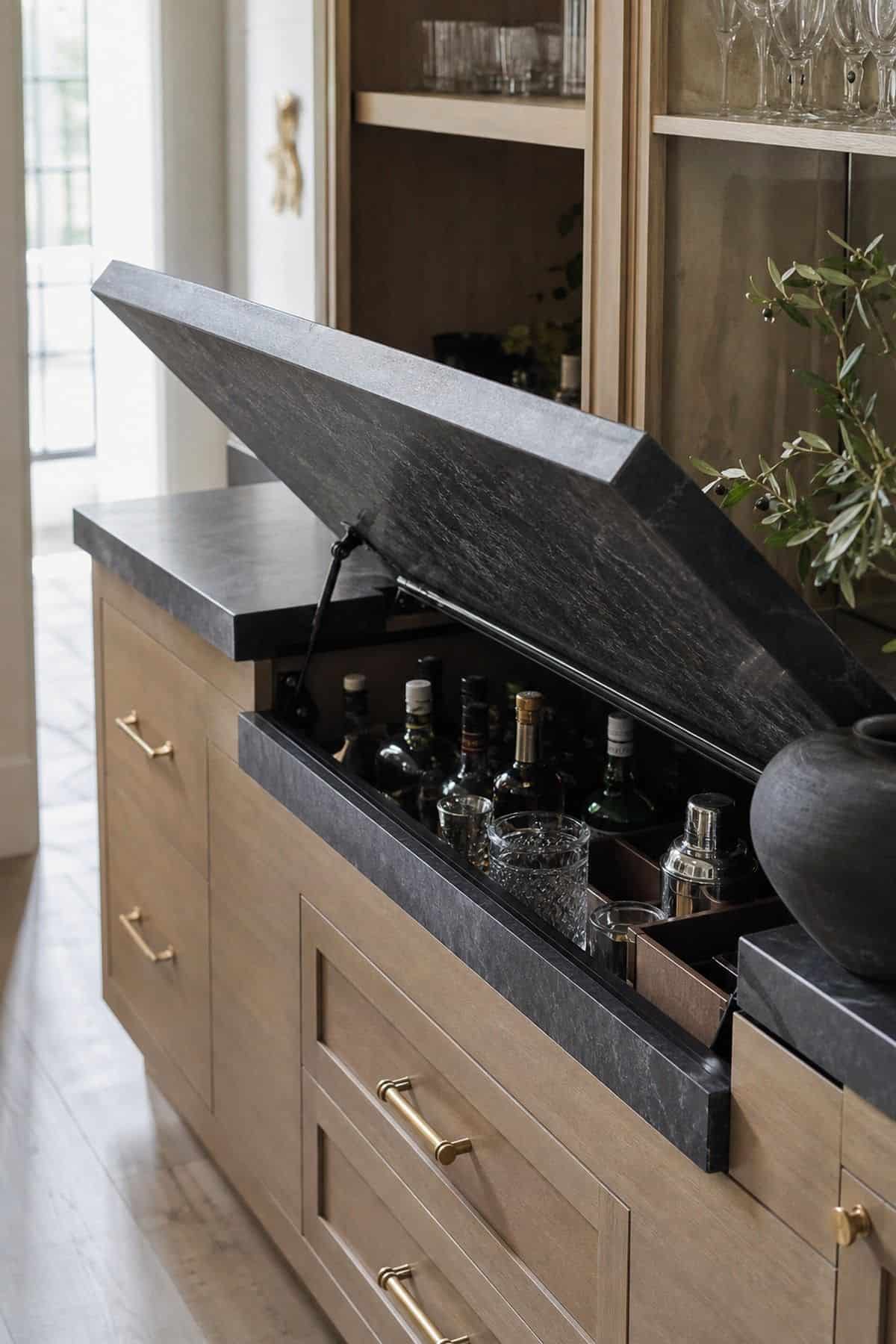 Countertop Segment That Lifts to Access Bar Items shown as a realistic Pretty Wild World image for 15 Hidden Bar Ideas for Home for a More Curated Home Aesthetic.