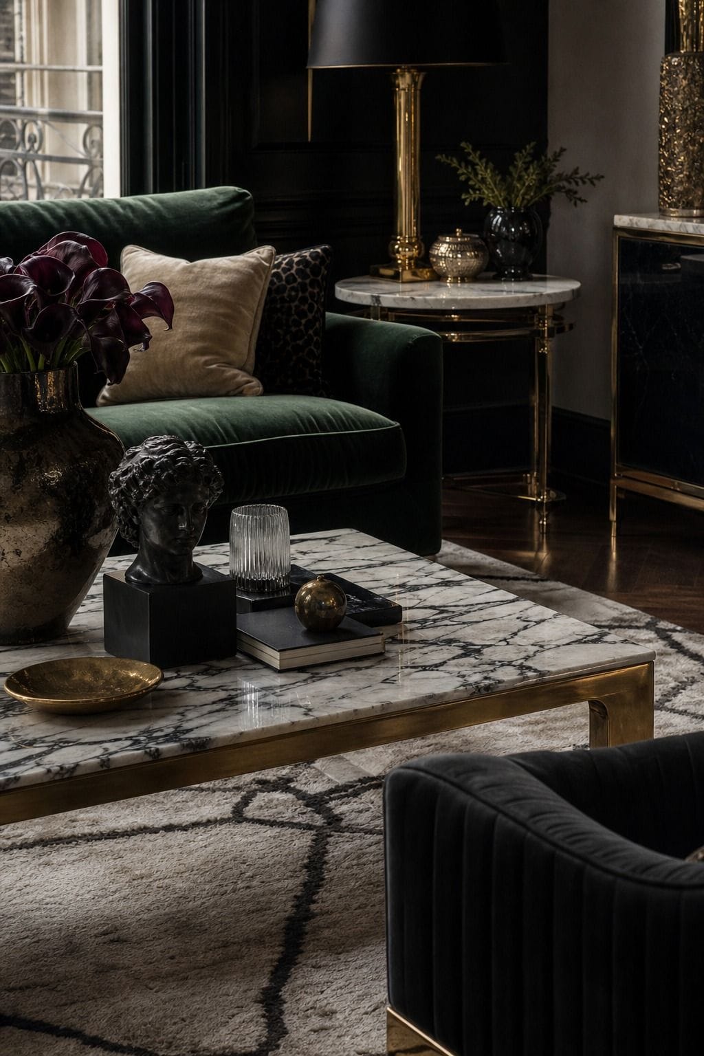 Hollywood Regency living room idea showing marble surfaces in a glamorous but livable space with velvet upholstery, brass details, glass or mirrored surfaces, crisp contrast, and layered decor. The image is meant to help readers picture how this specific design move can make a living room feel dramatic, polished, and editorial without becoming gaudy or overly themed, while still feeling comfortable enough for everyday hosting and lounging.