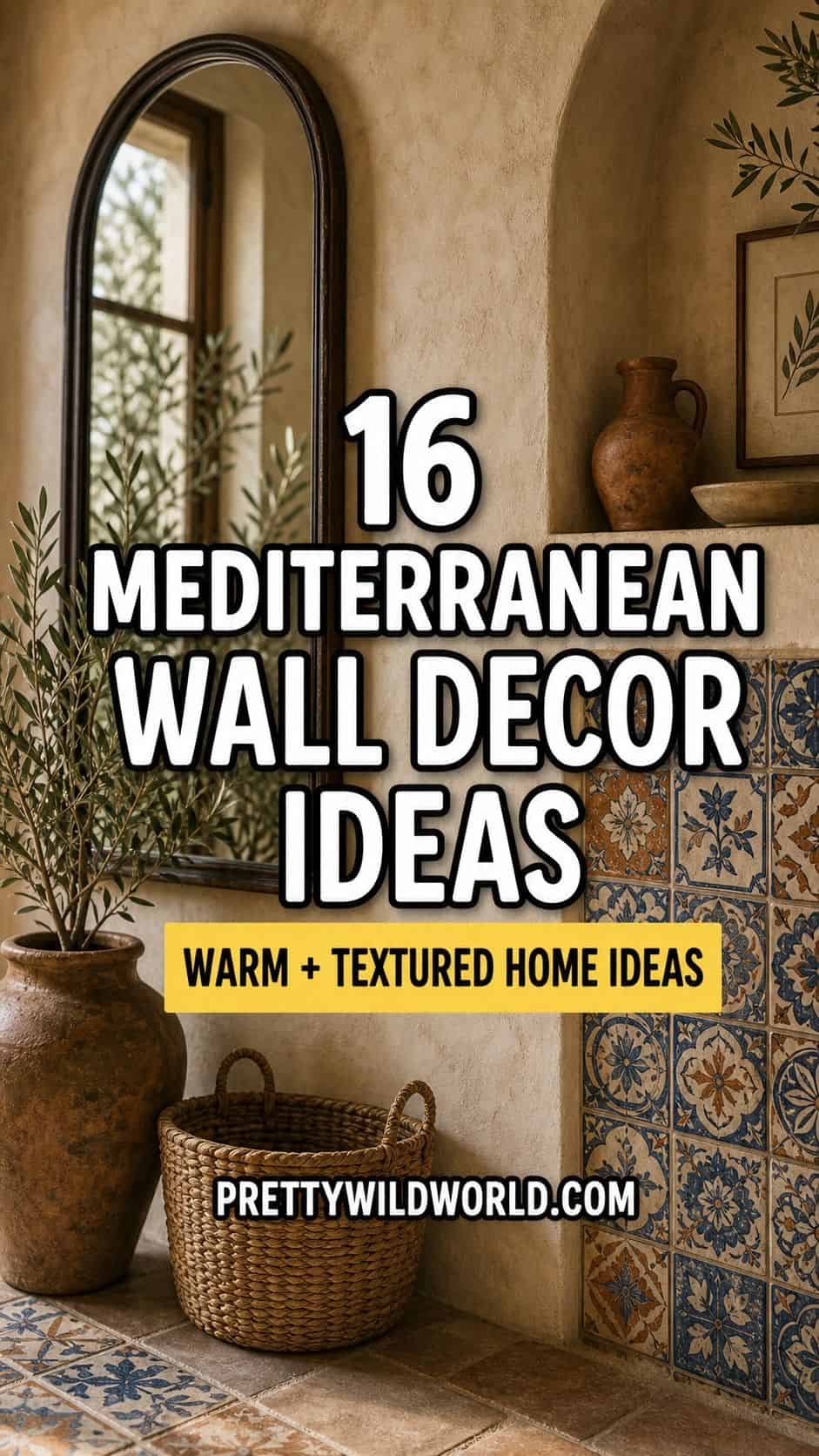 A bold vertical PrettyWildWorld Pinterest pin with a single Mediterranean interior hero image, warm limewash plaster, arched mirror, hand-painted tile, woven basket texture, terracotta decor, and olive branches behind large outlined text reading 16 Mediterranean Wall Decor Ideas. Designed for saving Mediterranean wall decor, Mediterranean home decor ideas, textured wall decor, limewash wall ideas, and warm neutral home decor inspiration.