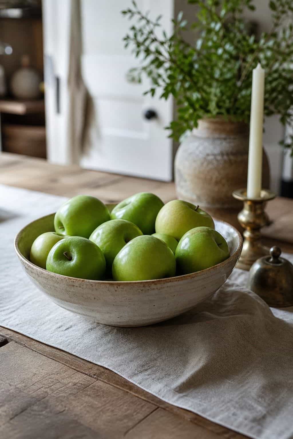Fill a bowl with green apples shown as a realistic Pretty Wild World image for 16 St. Patrick's Home Decor Ideas That Feel Green, Gold, and Grown Up.